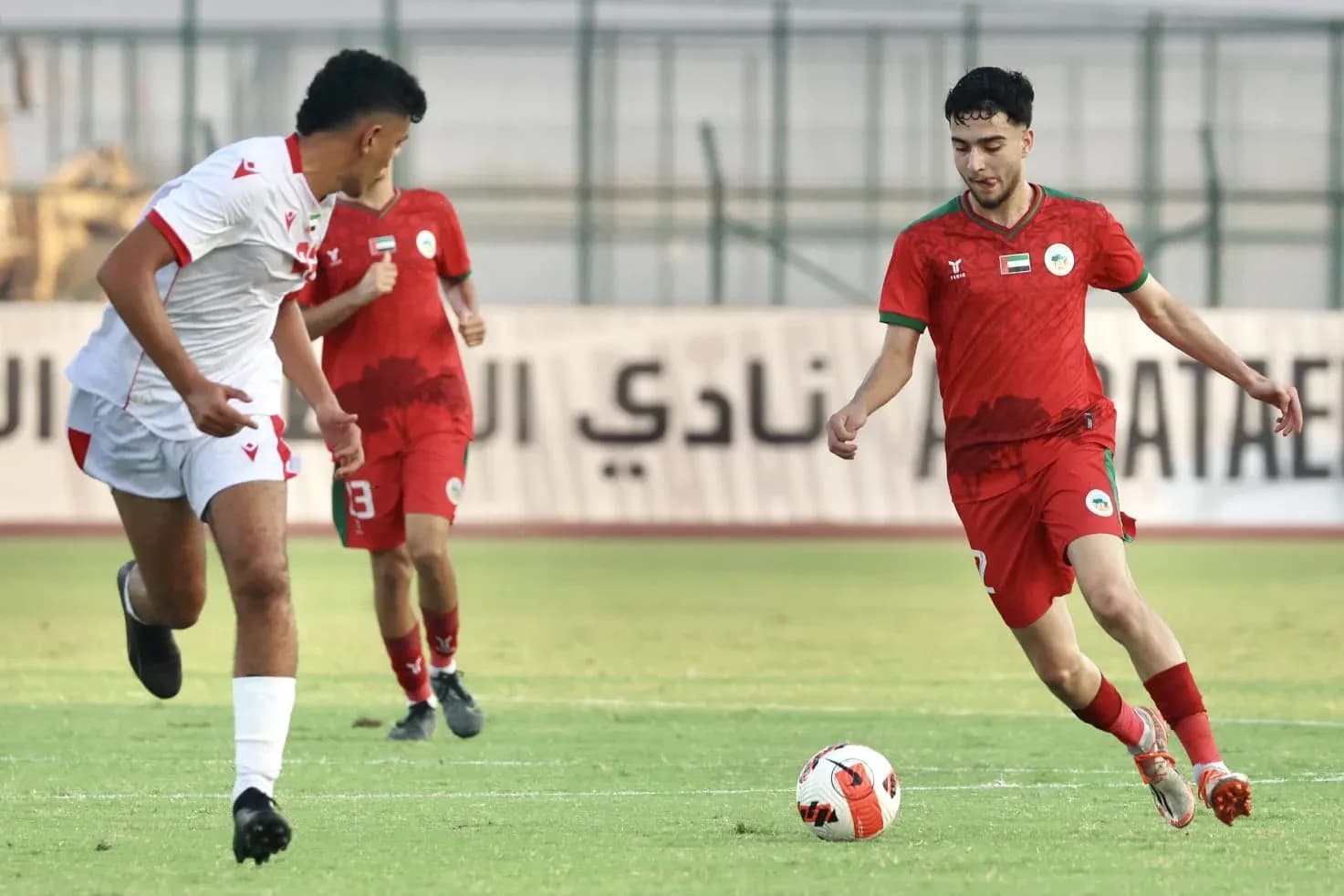 Al Sharjah U23 player dribbling during match Al Sharjah U23 player dribbling during match