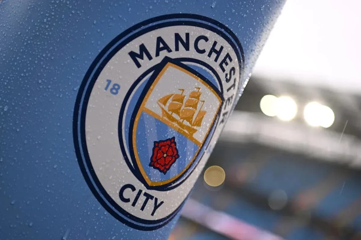 Close-up of Manchester City club crest with raindrops Close-up of Manchester City club crest with raindrops