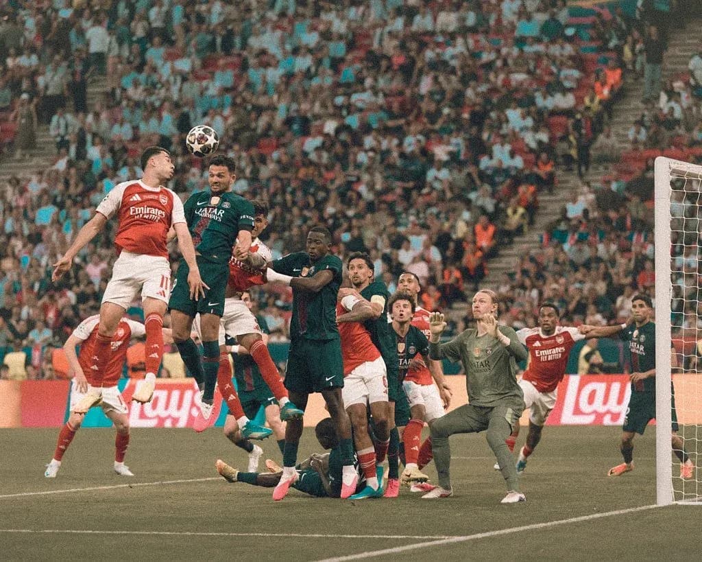 Players contesting a header during a corner kick Players contesting a header during a corner kick