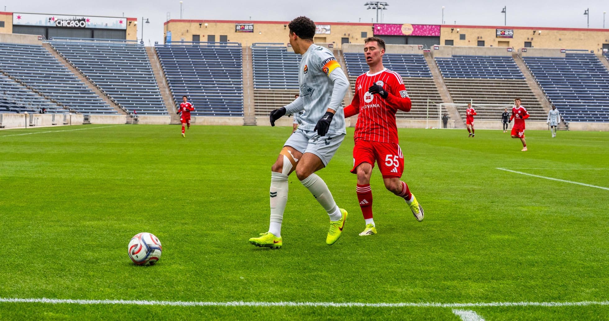 Goalkeeper and player competing for the ball Goalkeeper and player competing for the ball