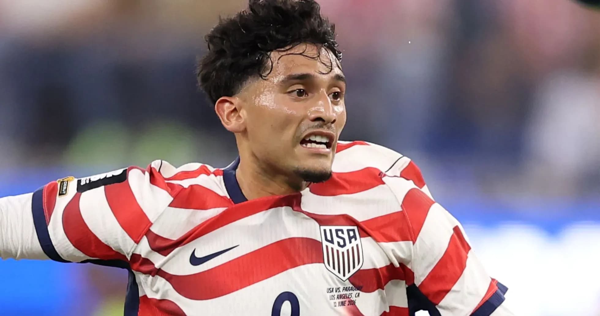 Player in USA kit celebrating during a match Player in USA kit celebrating during a match