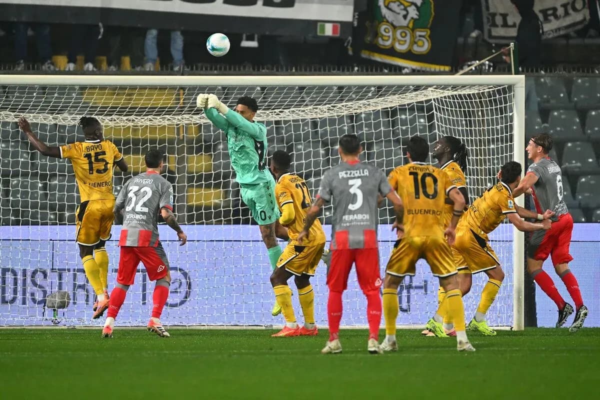 Goalkeeper saves shot during Udinese vs Cremonese match Goalkeeper saves shot during Udinese vs Cremonese match