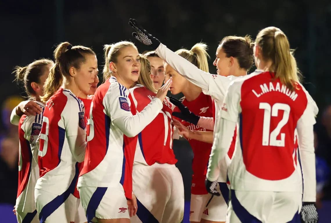 Arsenal women celebrating during a match Arsenal women celebrating during a match