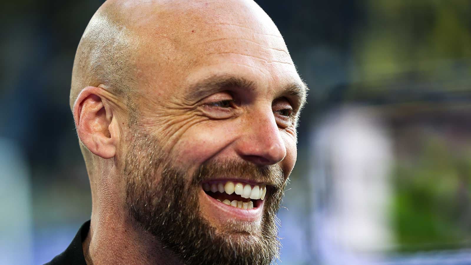 Close-up of a smiling man with a beard Close-up of a smiling man with a beard