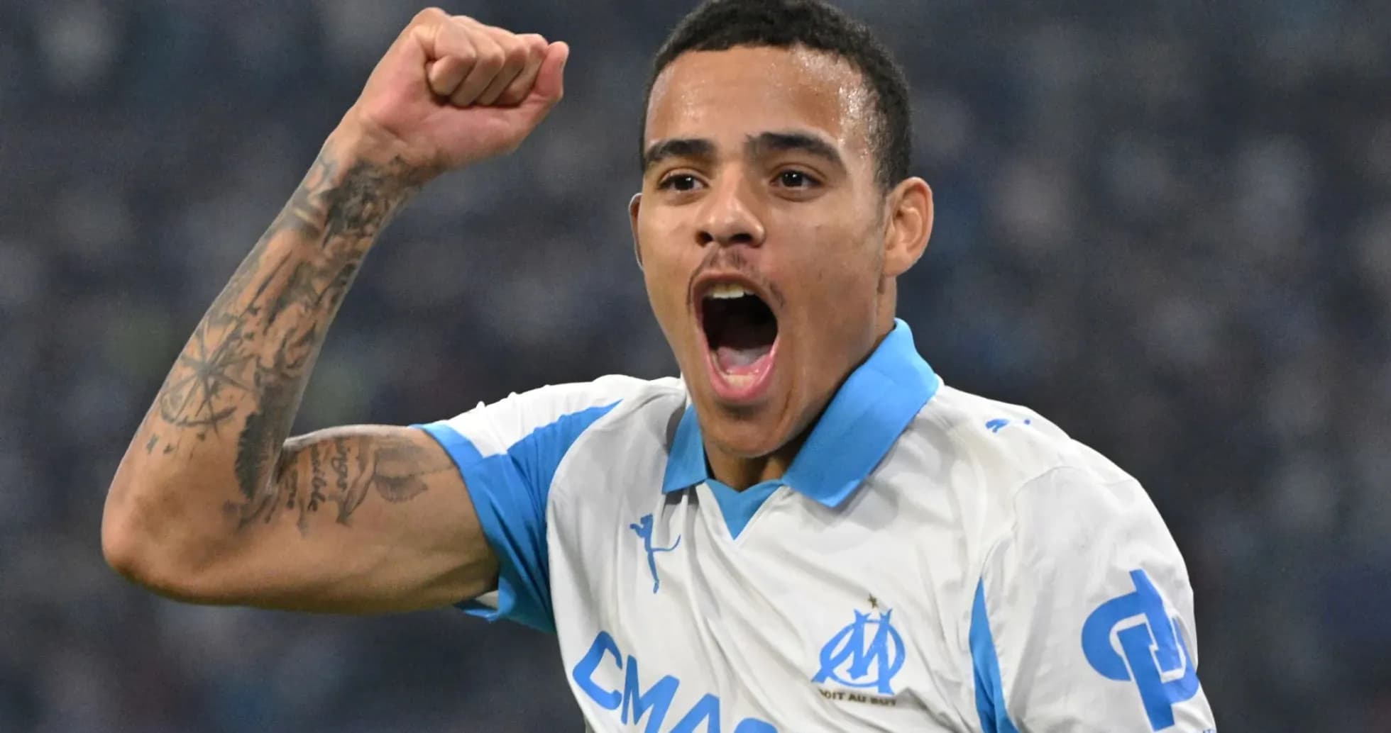 Player celebrating a goal with raised fist Player celebrating a goal with raised fist