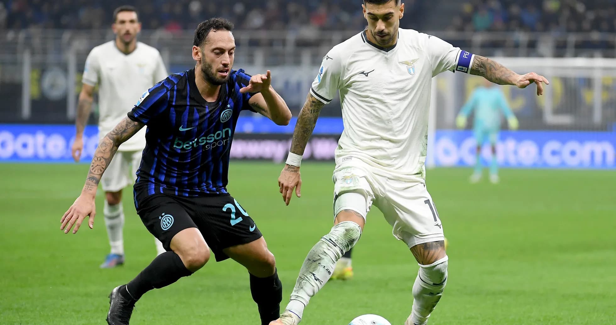 Lazio player dribbling against Inter defender Lazio player dribbling against Inter defender