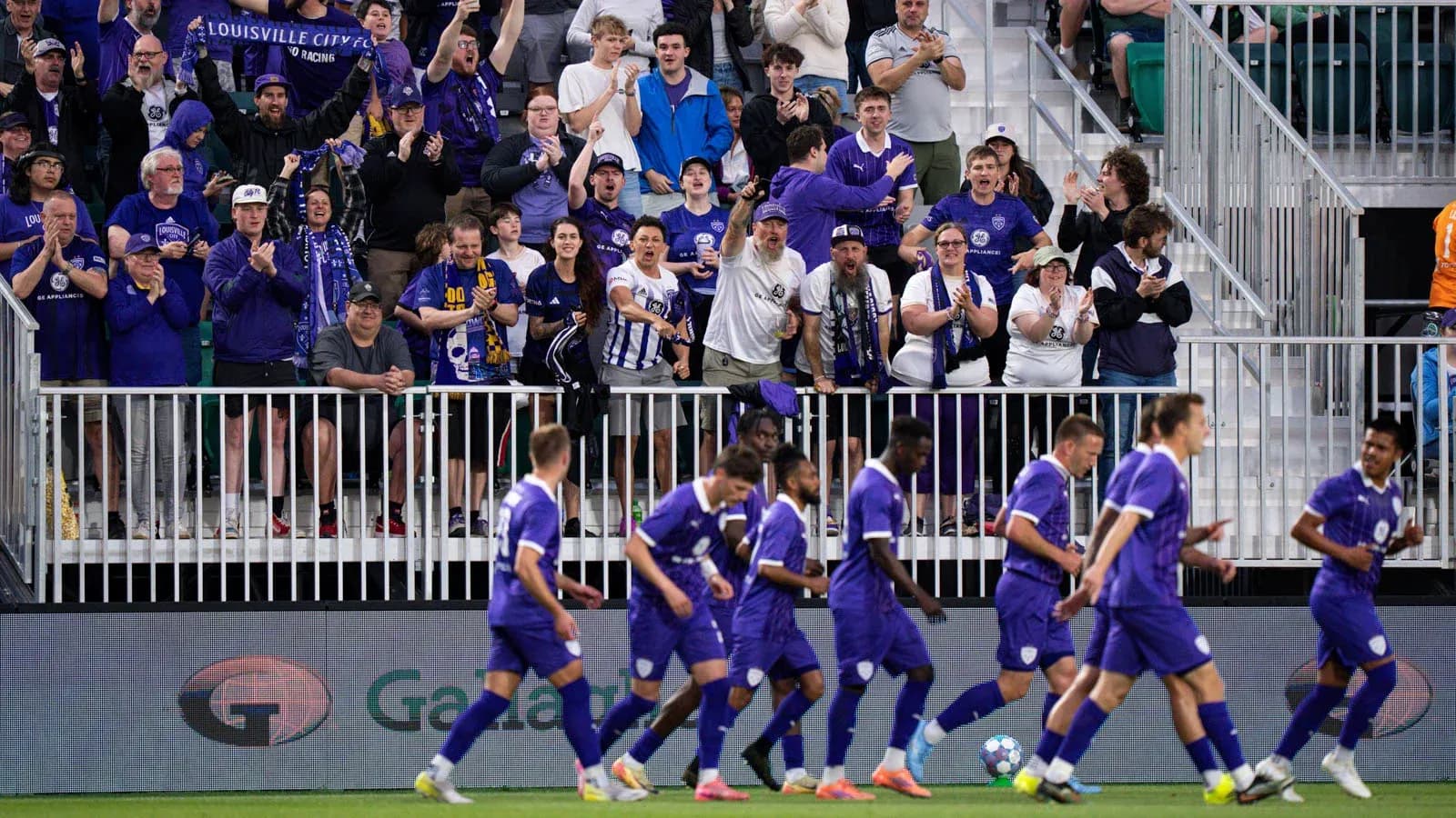Louisville City fans celebrating during a match Louisville City fans celebrating during a match