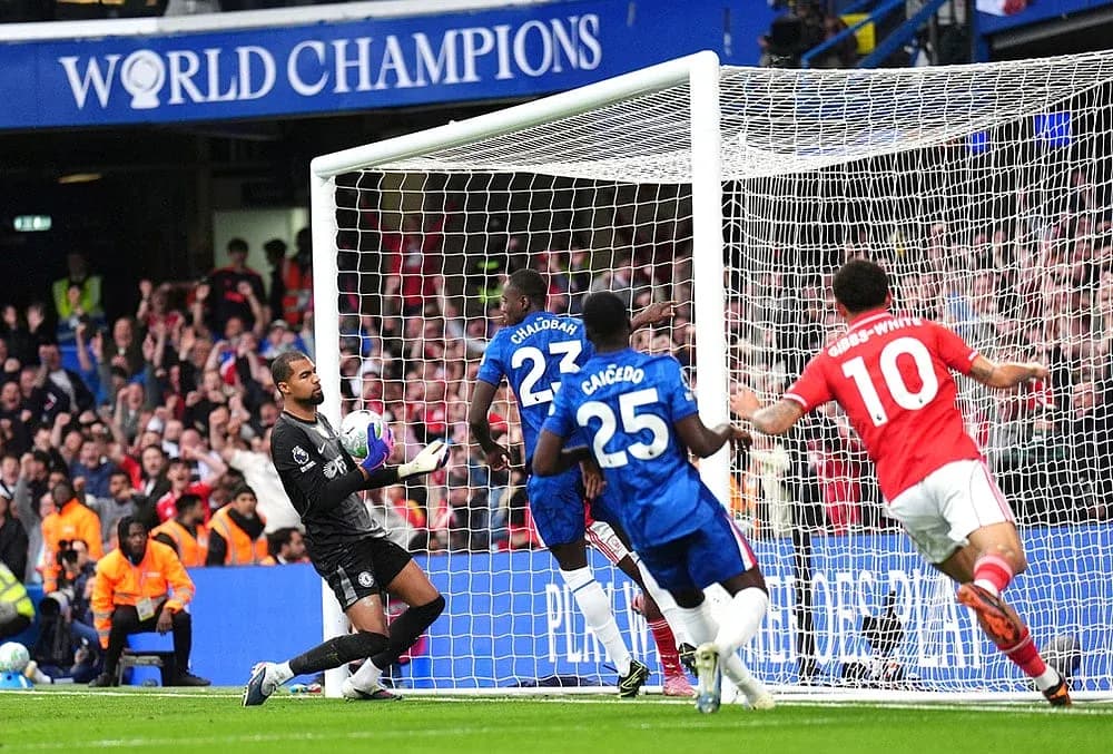 Goalkeeper saving a shot during Chelsea match Goalkeeper saving a shot during Chelsea match