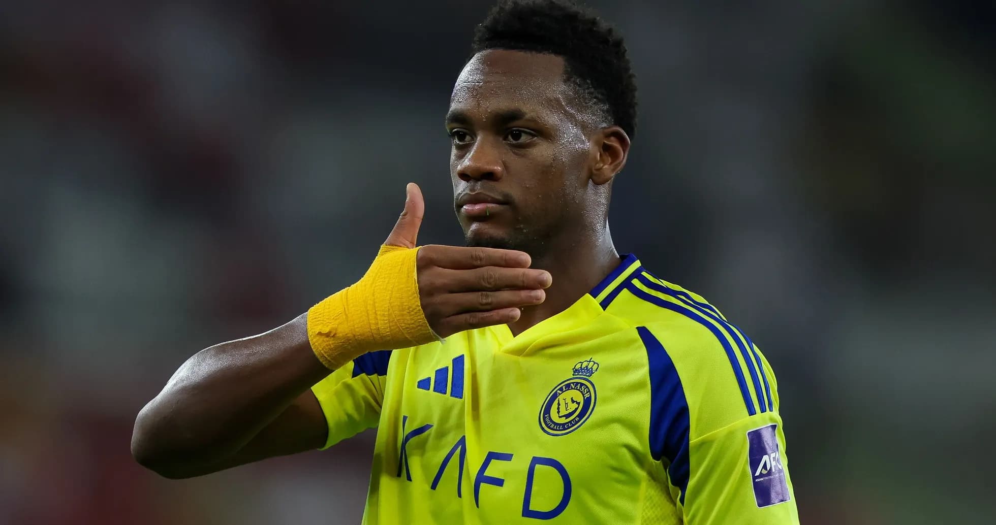 Player celebrating with hand gesture after match Player celebrating with hand gesture after match