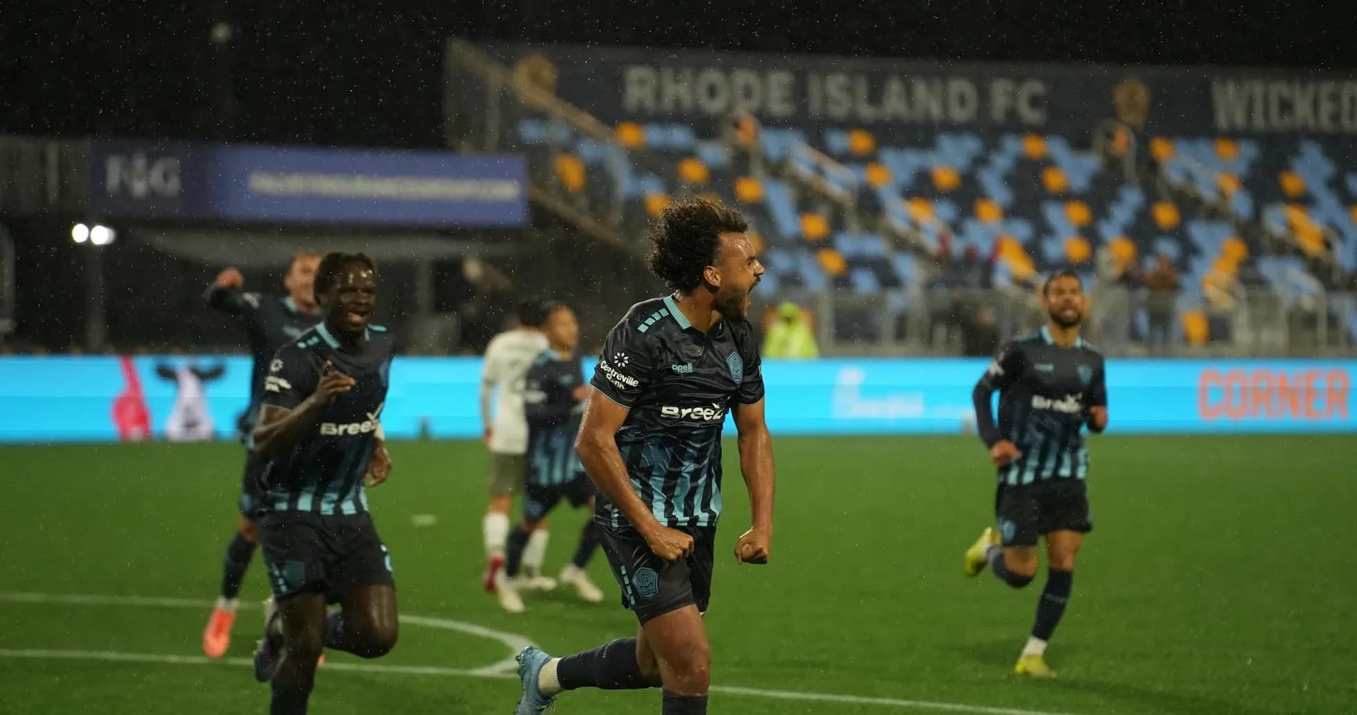 Rhode Island players celebrating a goal Rhode Island players celebrating a goal