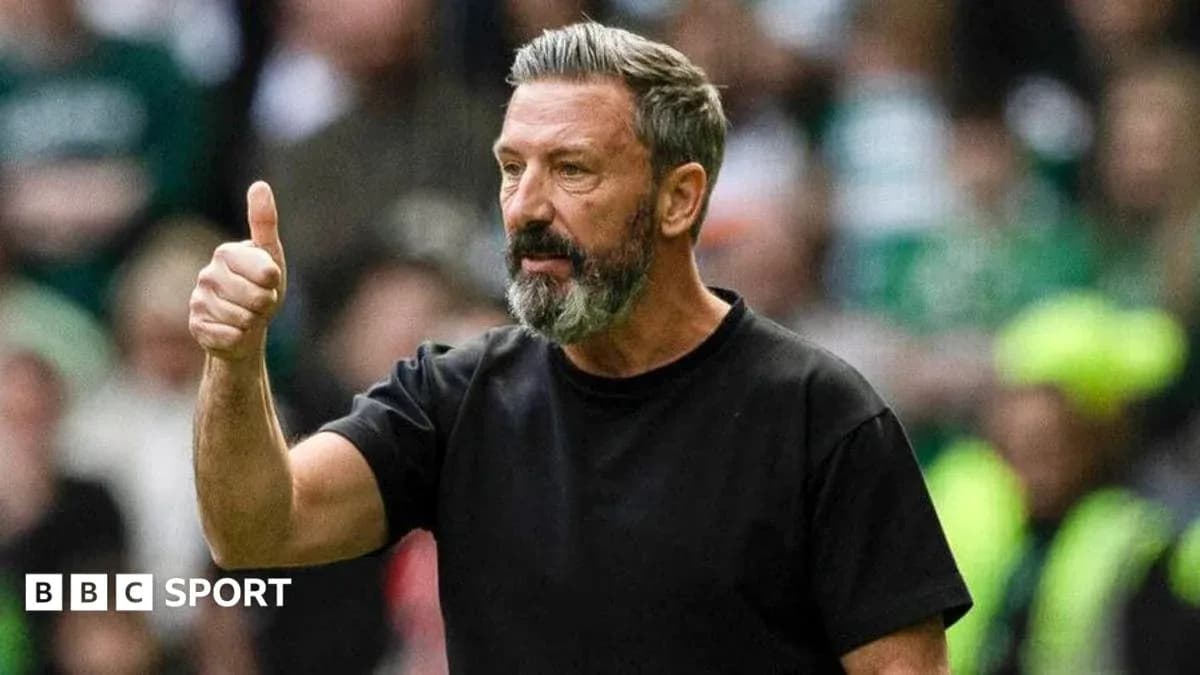 Manager giving thumbs up during match Manager giving thumbs up during match