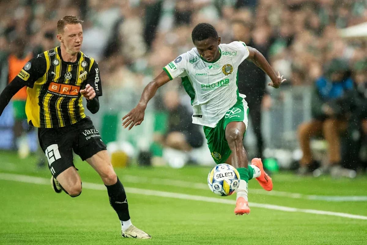 Player dribbling past opponent during football match Player dribbling past opponent during football match