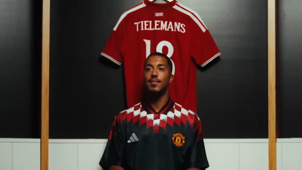 Player in Manchester United kit with jersey behind Player in Manchester United kit with jersey behind