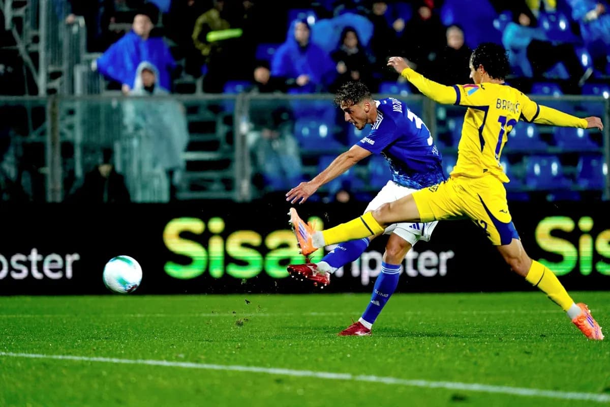 Player from Hellas Verona shooting the ball Player from Hellas Verona shooting the ball