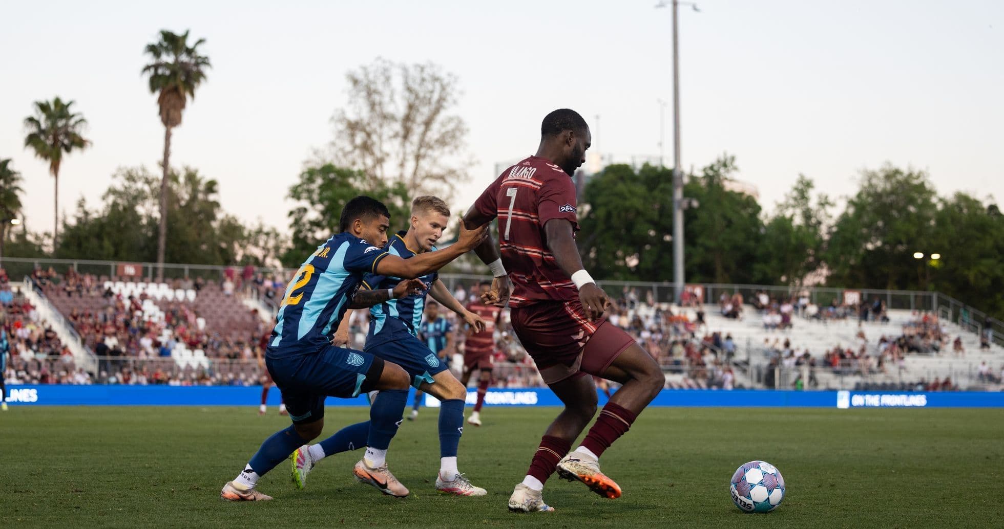 Players competing for the ball in a match Players competing for the ball in a match