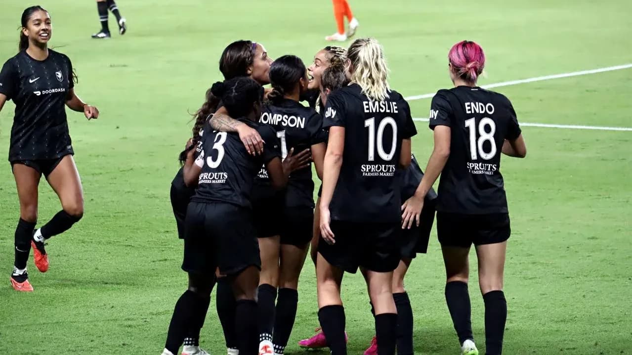Players celebrating a goal during NWSL match Players celebrating a goal during NWSL match
