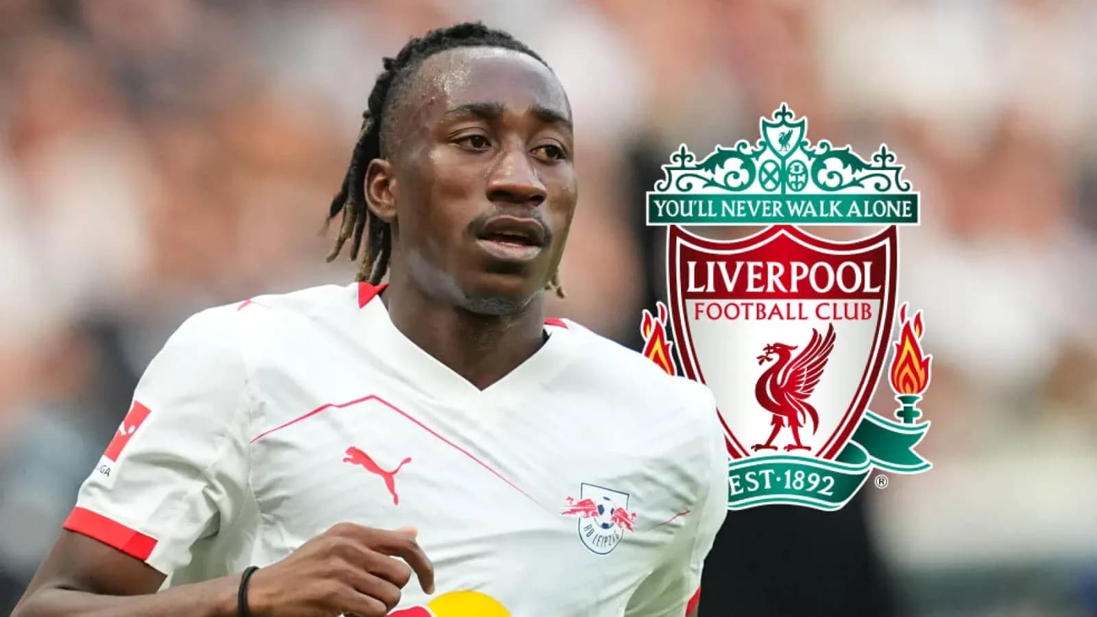 Player running with ball, Liverpool logo in background Player running with ball, Liverpool logo in background