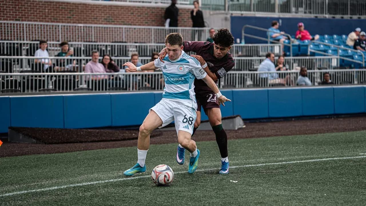 Player tackling opponent during MLS Next Pro match Player tackling opponent during MLS Next Pro match