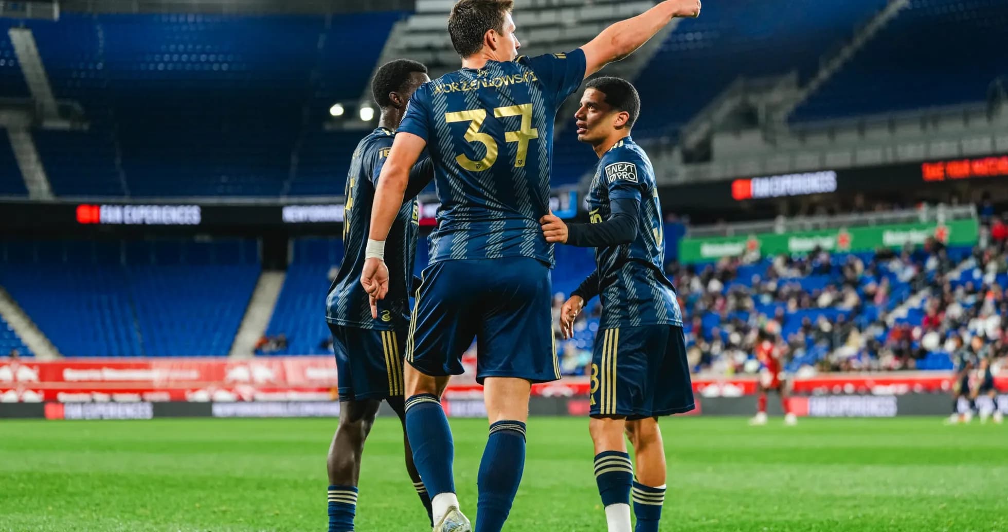 Players celebrating a goal during match Players celebrating a goal during match