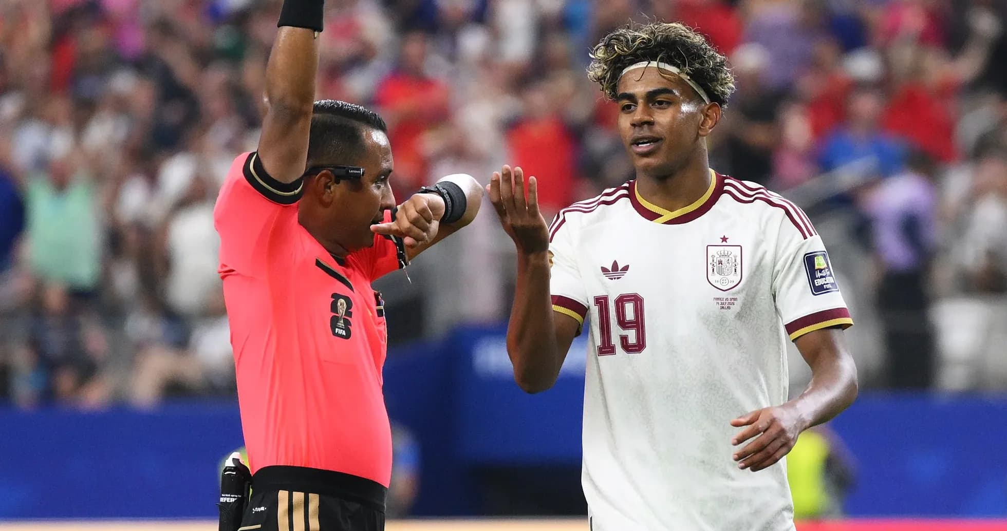 Referee signaling player during soccer match Referee signaling player during soccer match