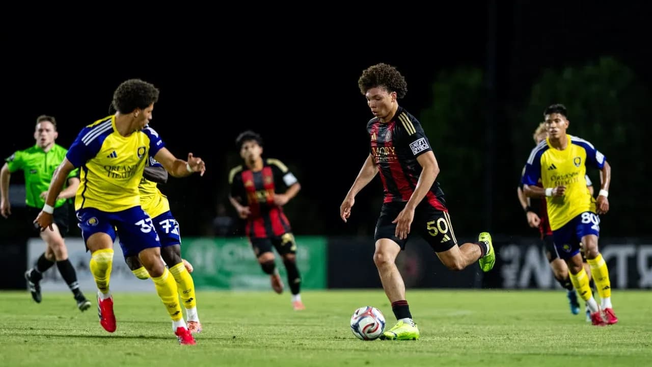 Atlanta United II player dribbling against Orlando City II Atlanta United II player dribbling against Orlando City II