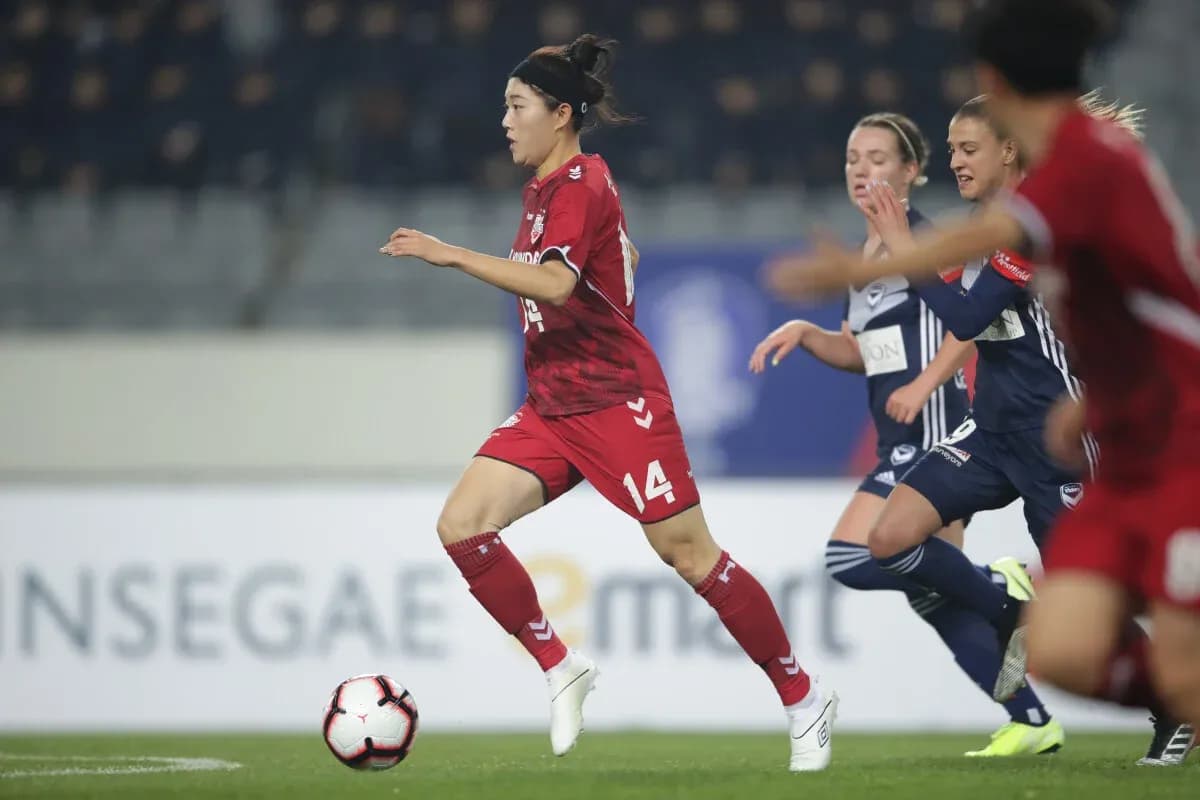 Incheon Red Angels W player dribbling the ball Incheon Red Angels W player dribbling the ball