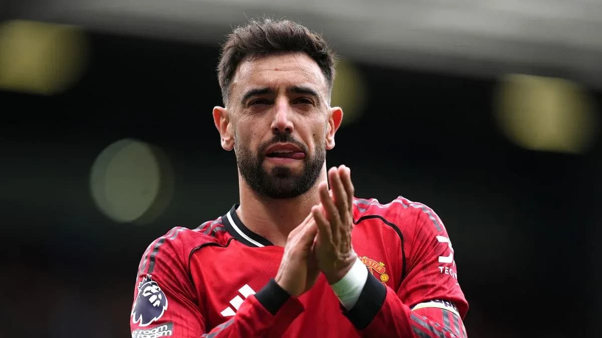 Player applauding fans wearing Manchester United jersey Player applauding fans wearing Manchester United jersey