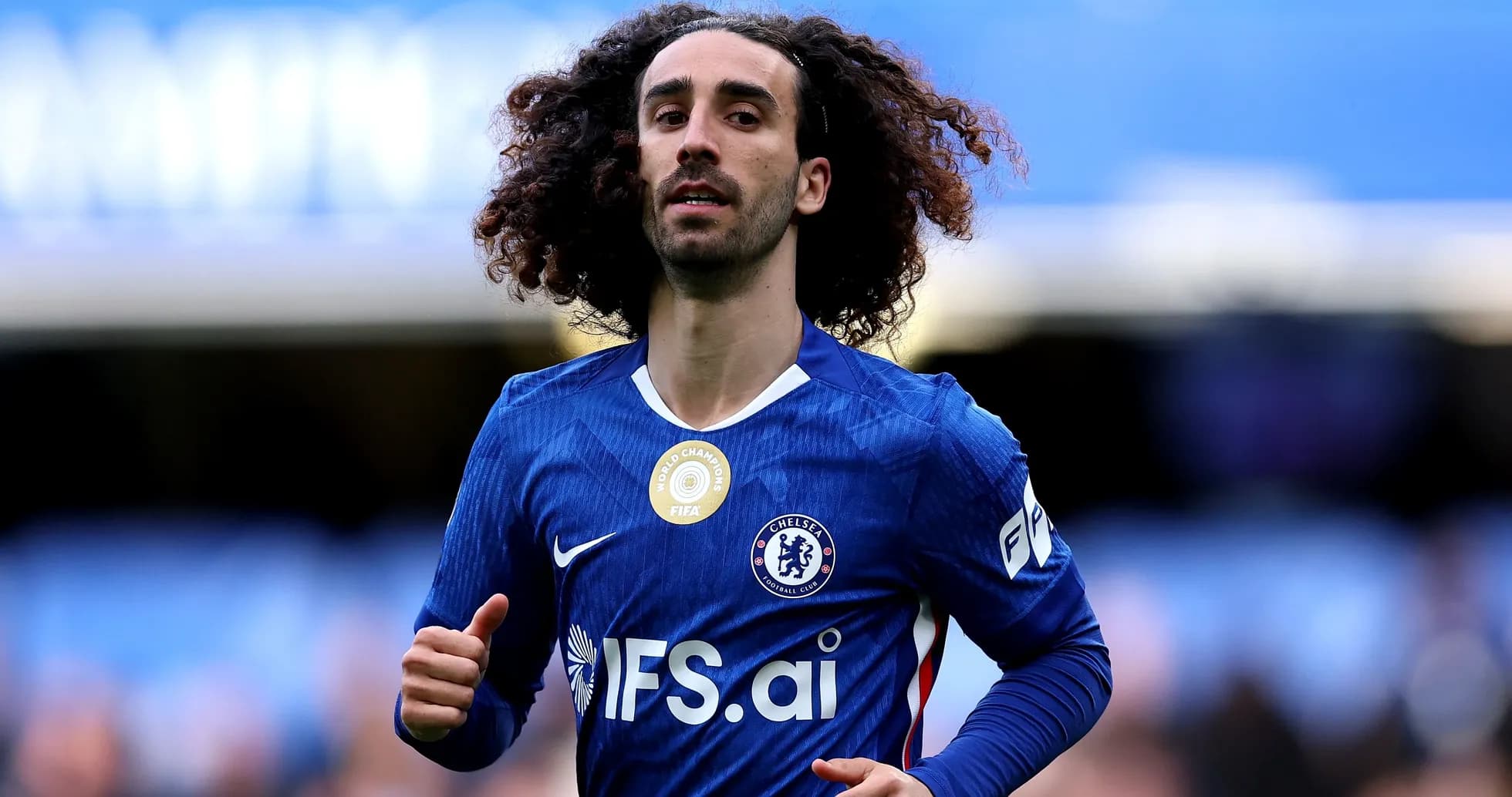 Chelsea player running on the pitch during match Chelsea player running on the pitch during match