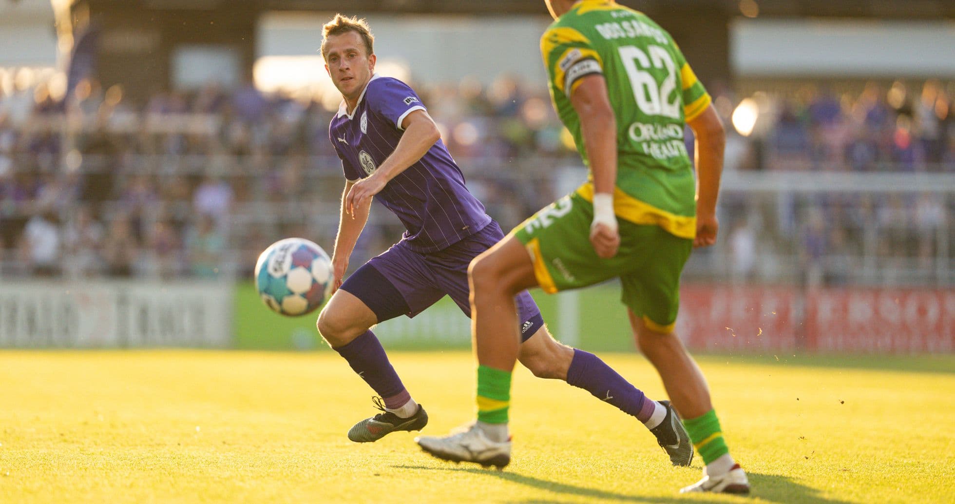 Louisville City player dribbling against Tampa Bay Rowdies Louisville City player dribbling against Tampa Bay Rowdies