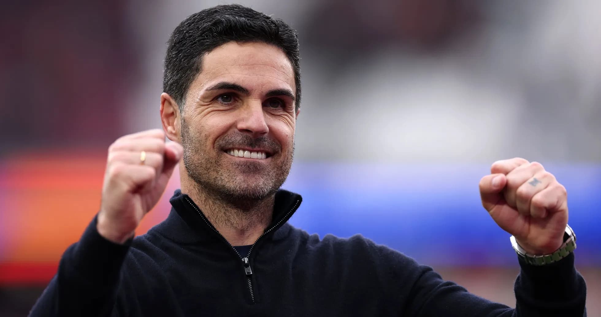 Coach celebrating with raised fists during match Coach celebrating with raised fists during match