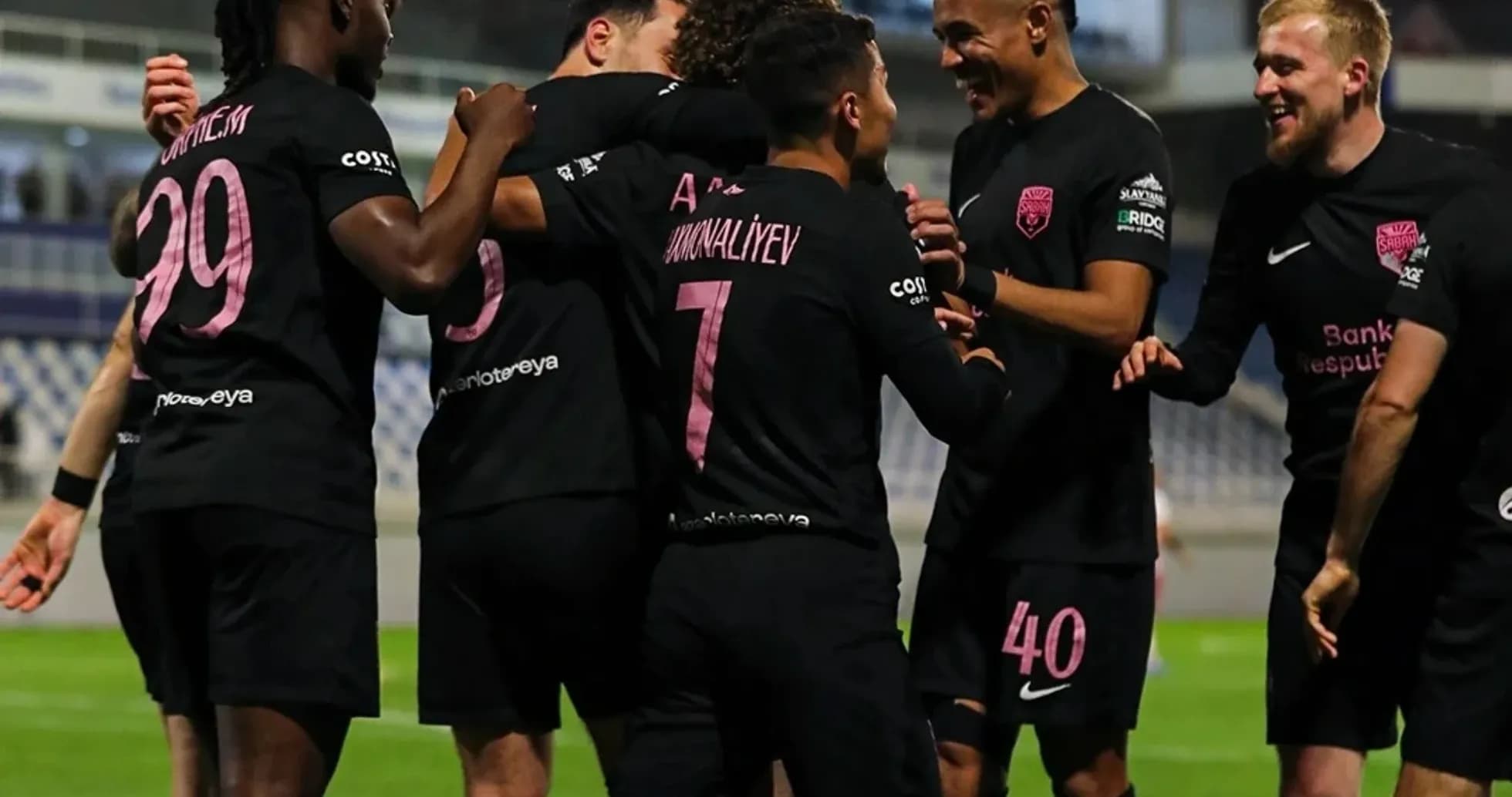 Players celebrating goal during UEFA match Players celebrating goal during UEFA match