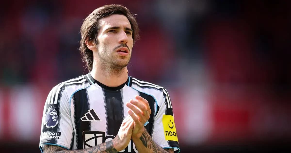 Player wearing Newcastle United jersey on the field Player wearing Newcastle United jersey on the field