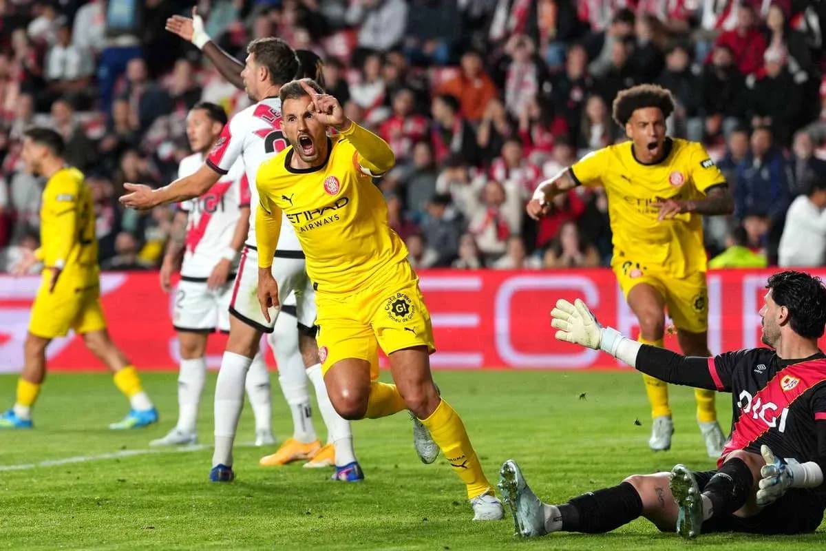 Player celebrating a goal against the goalkeeper Player celebrating a goal against the goalkeeper