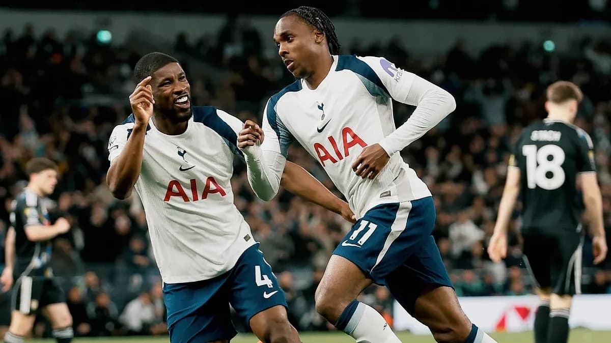 Two Tottenham players celebrating a goal Two Tottenham players celebrating a goal