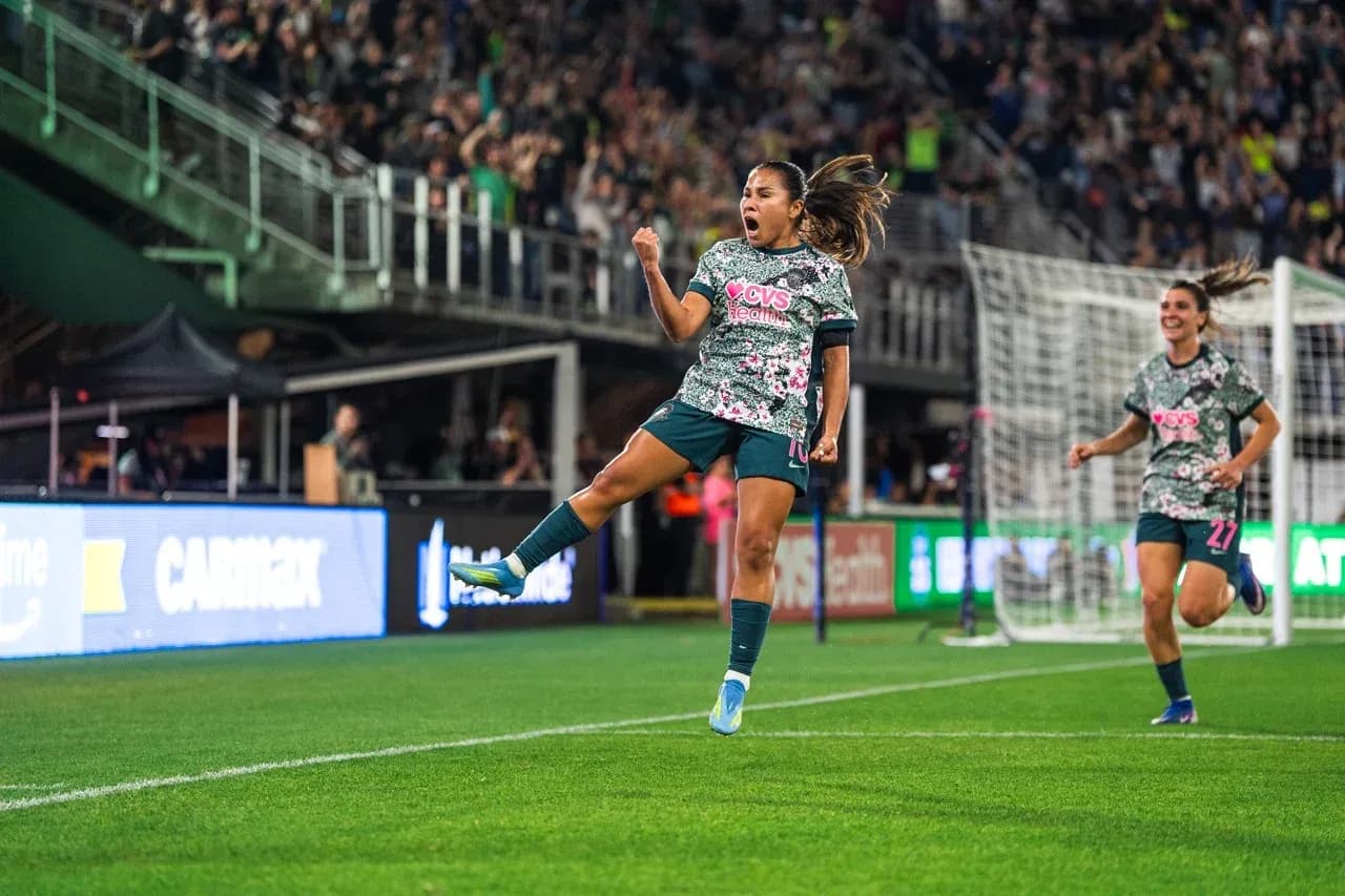 Player celebrating goal during Seattle Reign FC match Player celebrating goal during Seattle Reign FC match