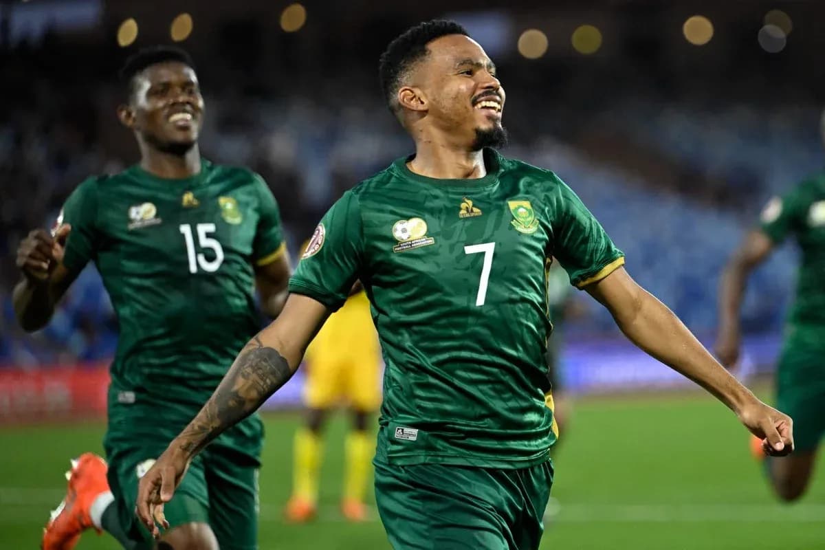 Player celebrating a goal with teammates during match Player celebrating a goal with teammates during match