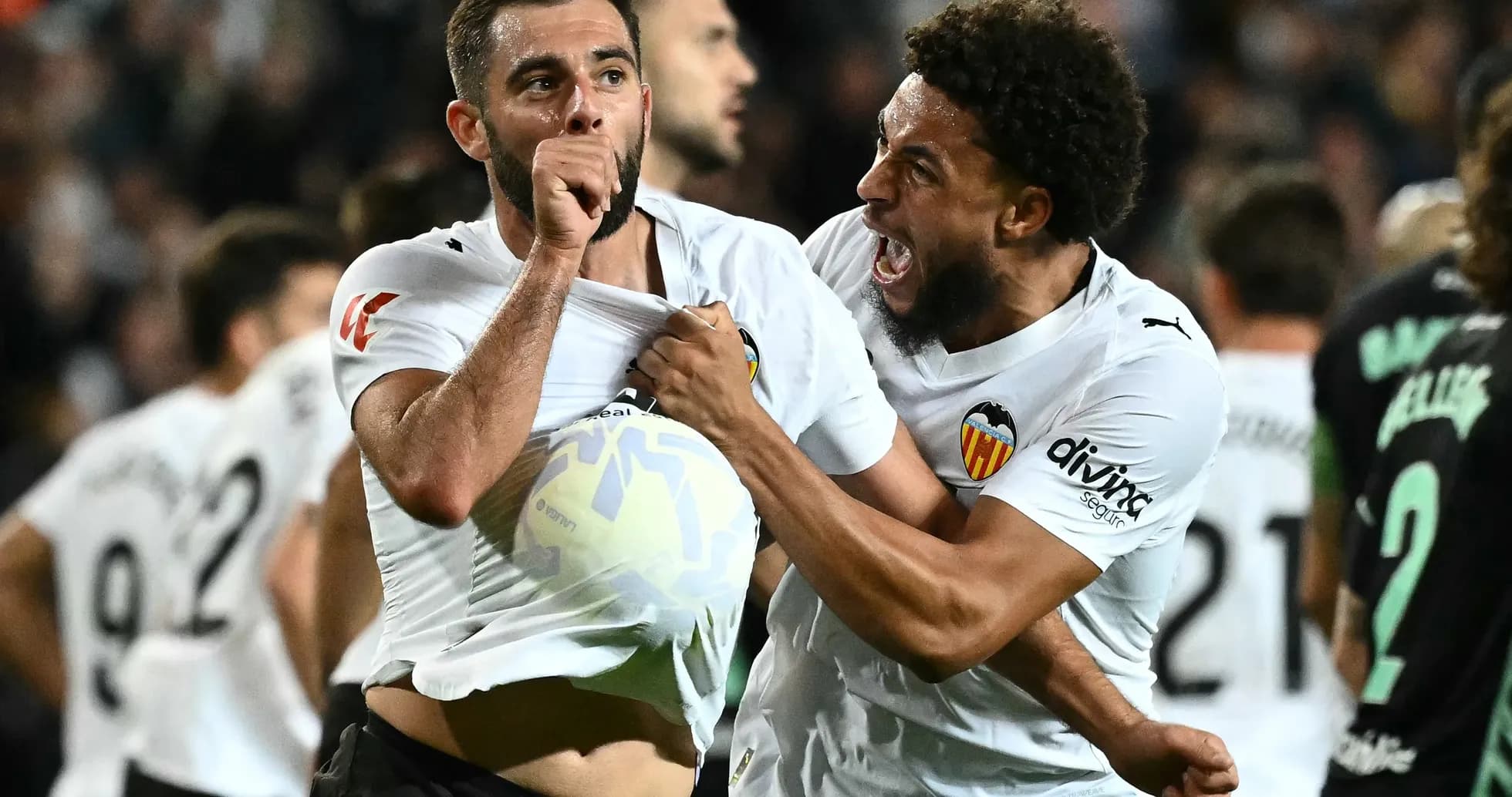 Valencia players celebrating a goal during match Valencia players celebrating a goal during match